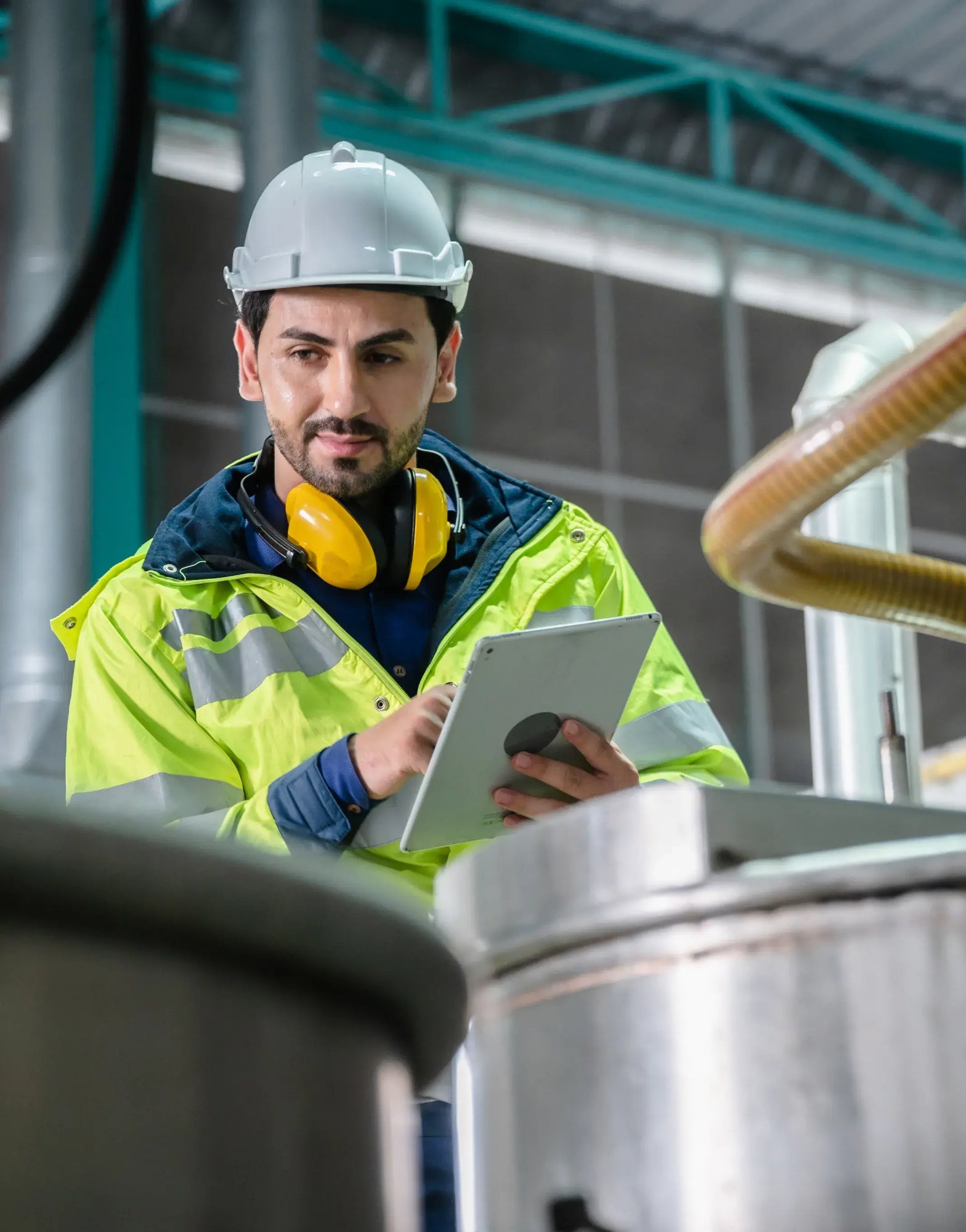 Man-inspecting-food-processing-equipment